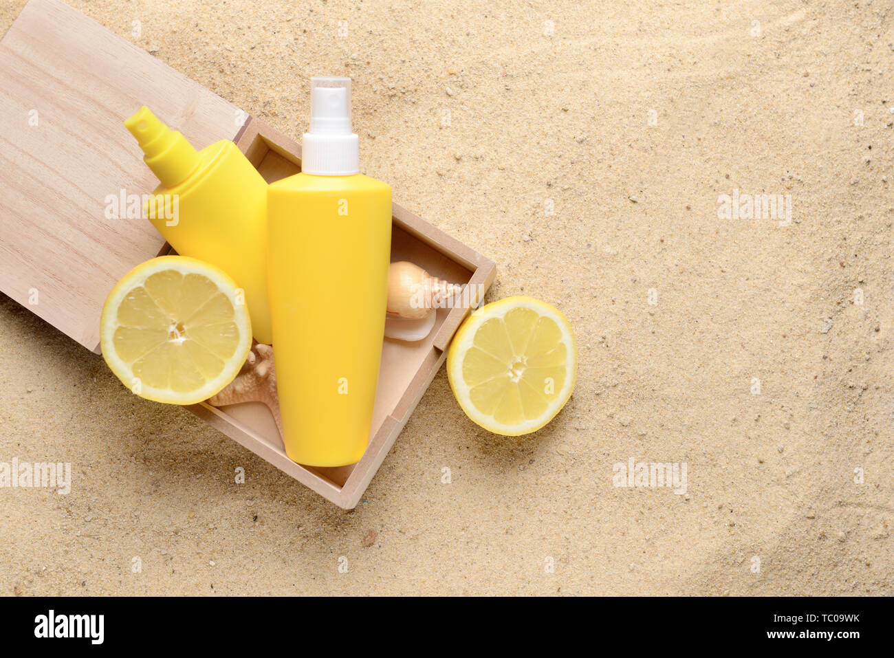 Bottles of sun protection cream in box on sand Stock Photo - Alamy