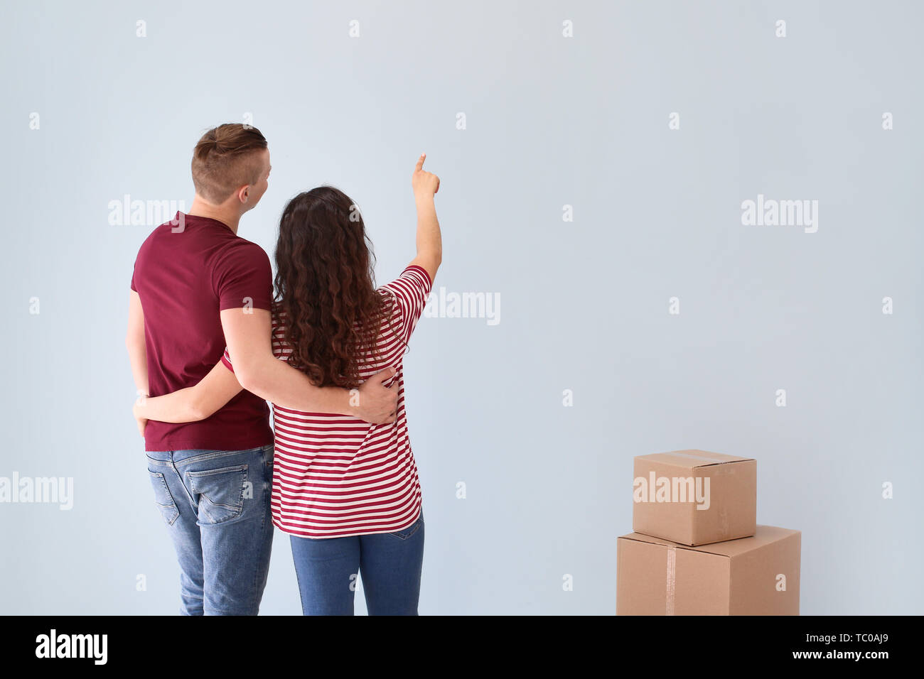 Adorable loving couple after moving into new house Stock Photo - Alamy