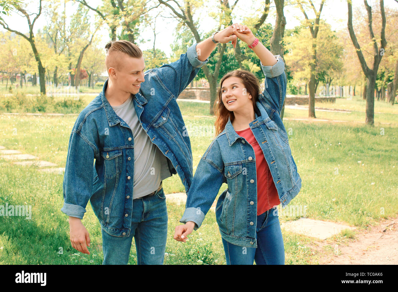 Happy loving couple dancing in park Stock Photo