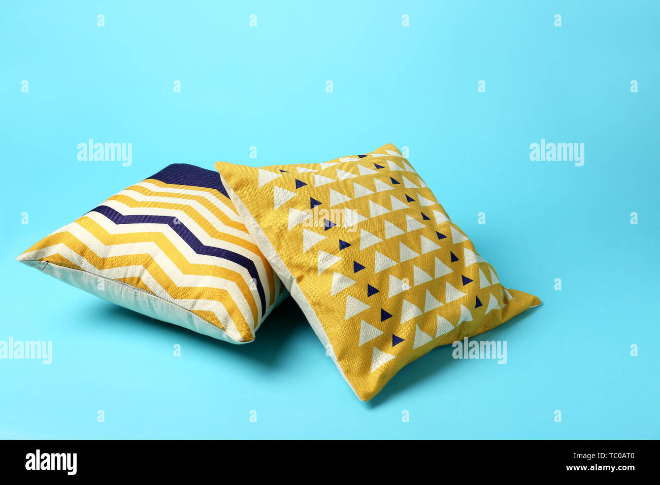 Soft pillows on color background Stock Photo