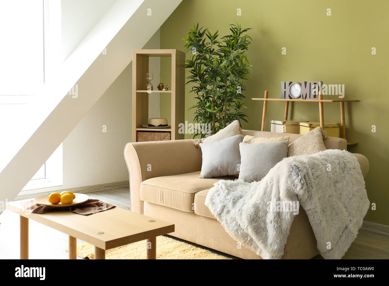 Interior of modern room with comfortable sofa Stock Photo - Alamy