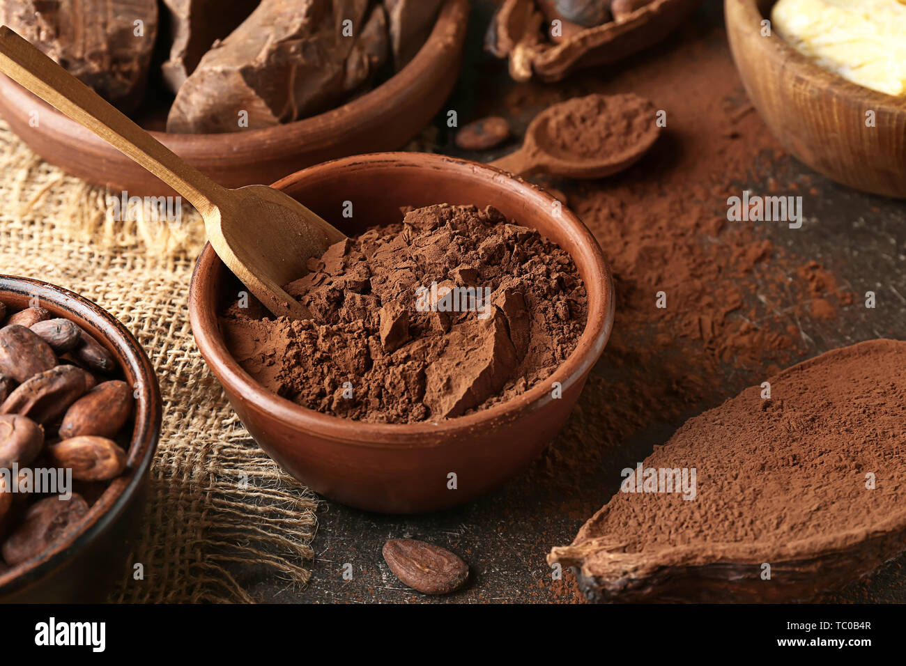Bowl with cocoa powder on table Stock Photo