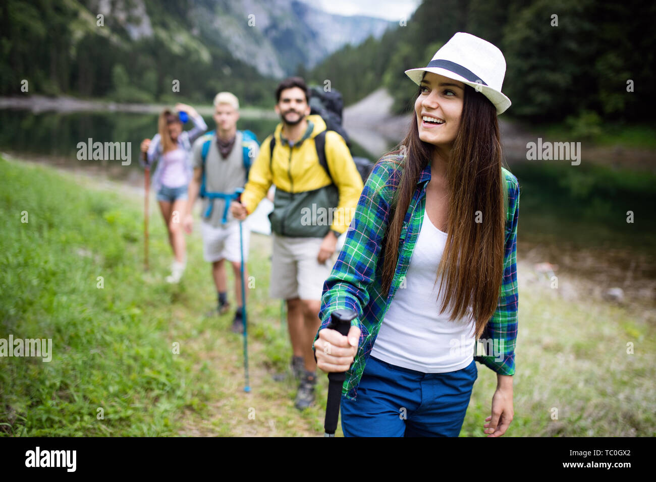 Group young people backpacks hi-res stock photography and images - Alamy
