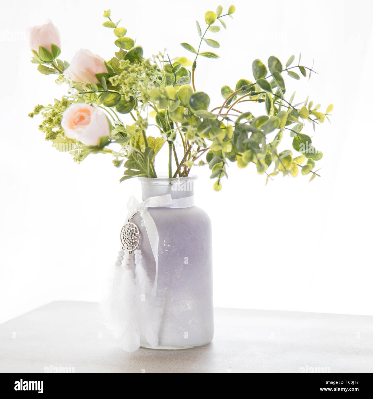 Dried flowers. Field dry spikelets and herbs in vases on a light