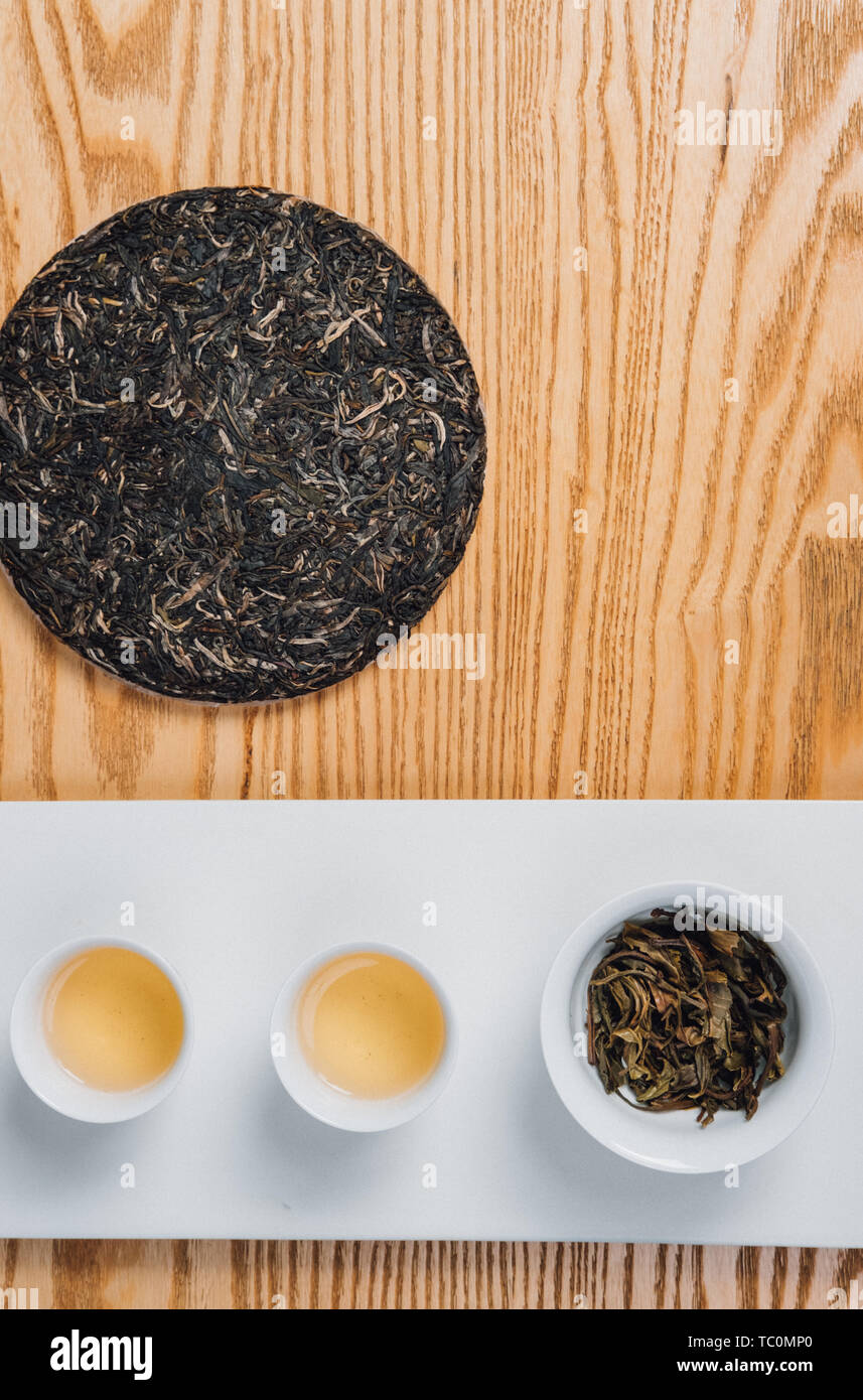 Pu Er Raw Tea Tea Cake And Tea Soup Stock Photo Alamy