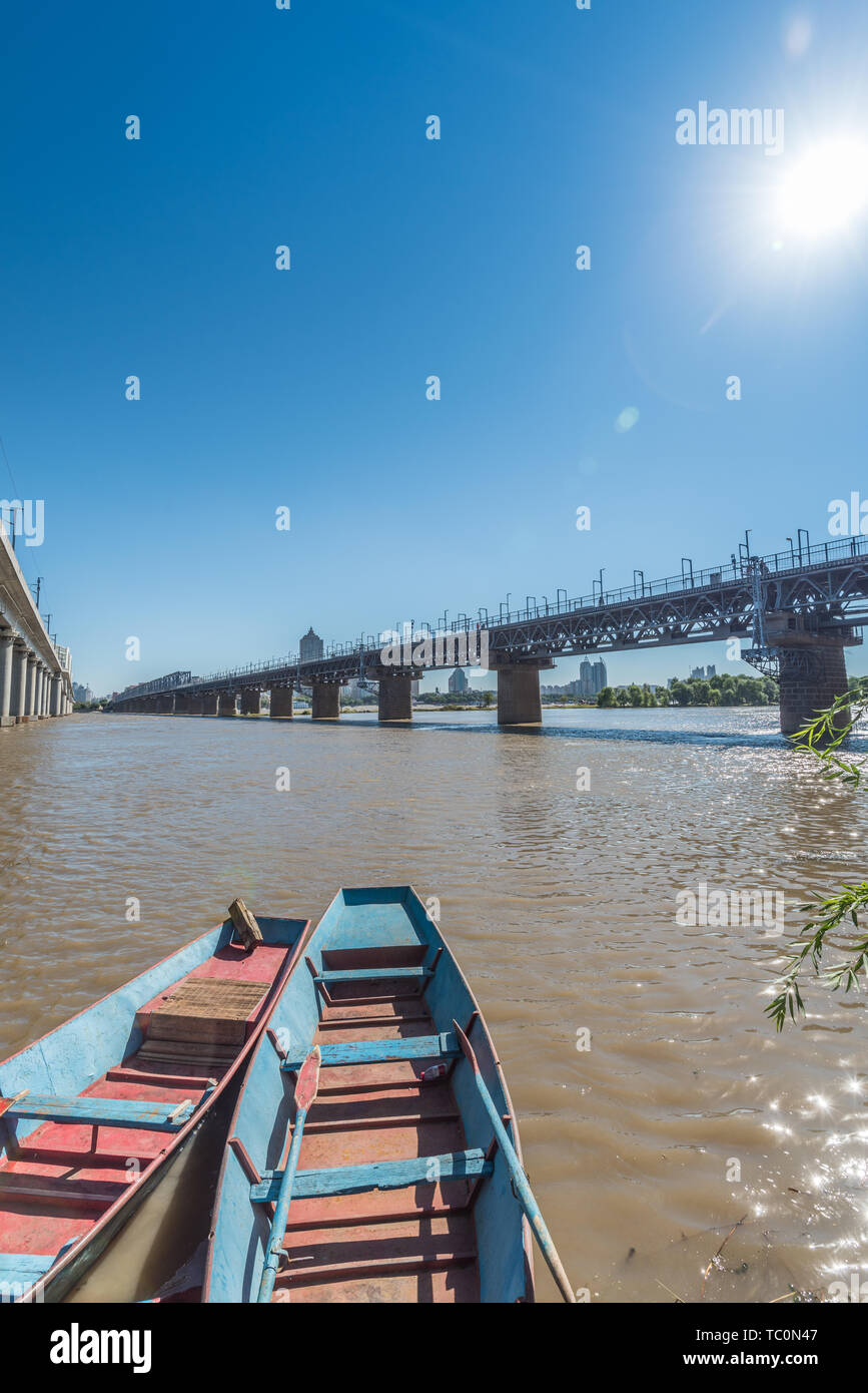 Songhua River Railway Bridge under Autumn Sunny Day in Harbin, China Stock Photo