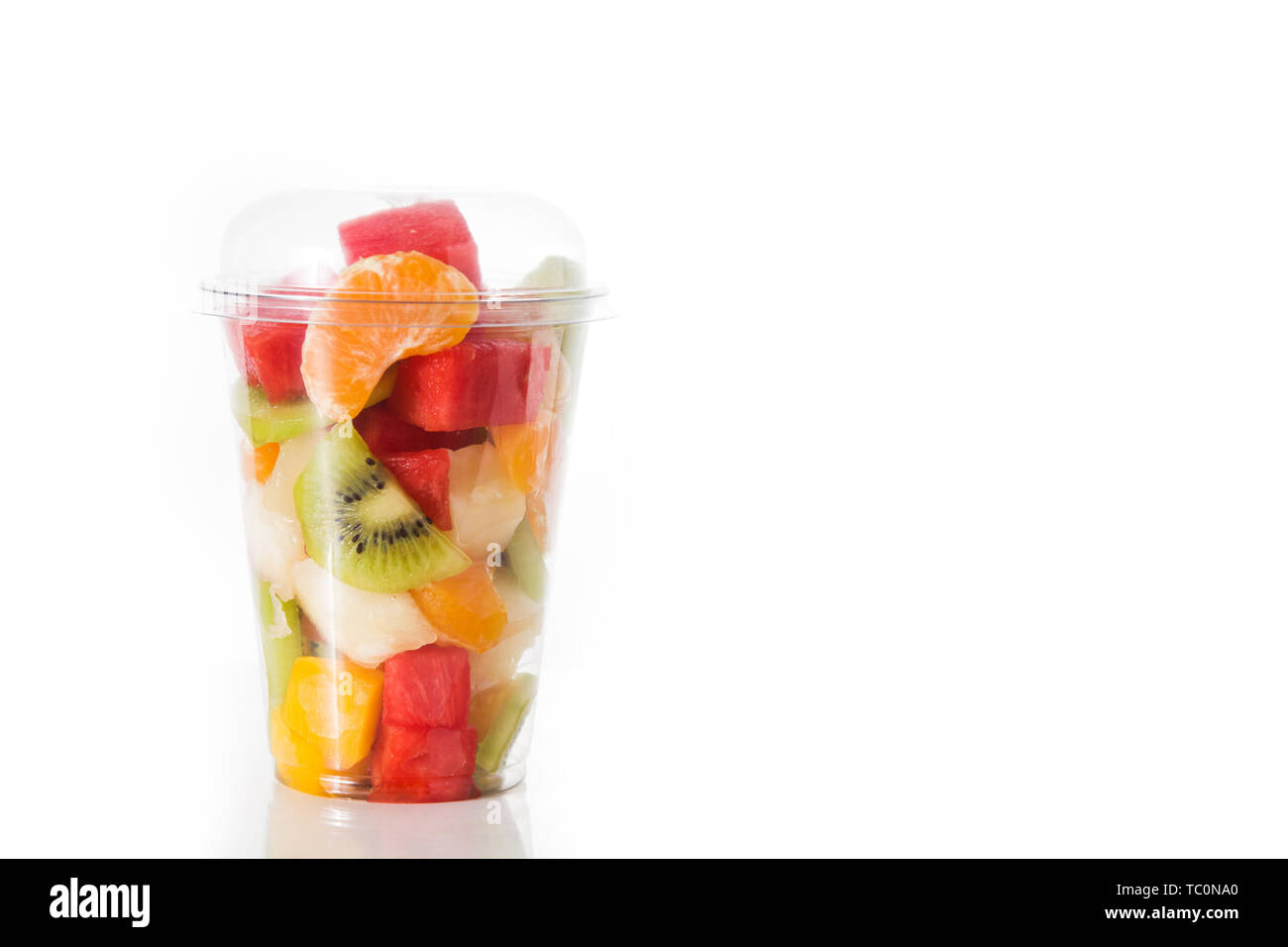 Fresh cut fruit in a plastic cup isolated on white background Stock Photo