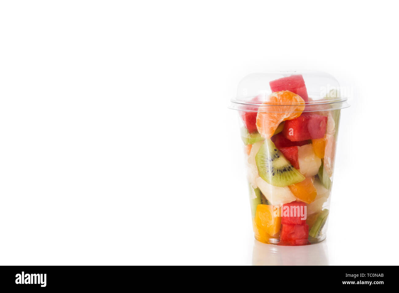 Fresh cut fruit in a plastic cup isolated on white background Stock Photo