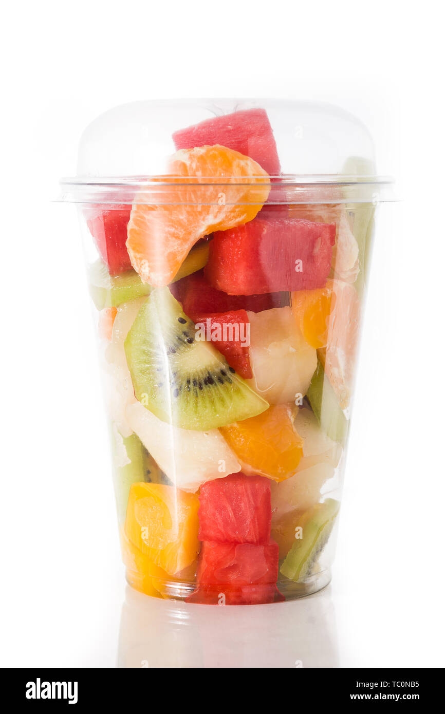 Delicious fruit salad in plastic cup on white background Stock Photo - Alamy