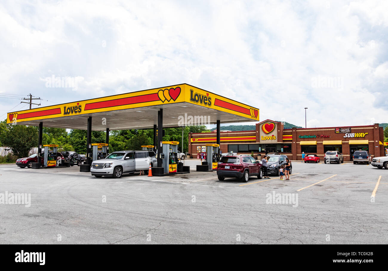 MARION, NC, USA-5/31/19: Love's gas station for autos, with a Love's convenience store, a Godfather's Pizza, and a Subway sandwich shop. Stock Photo