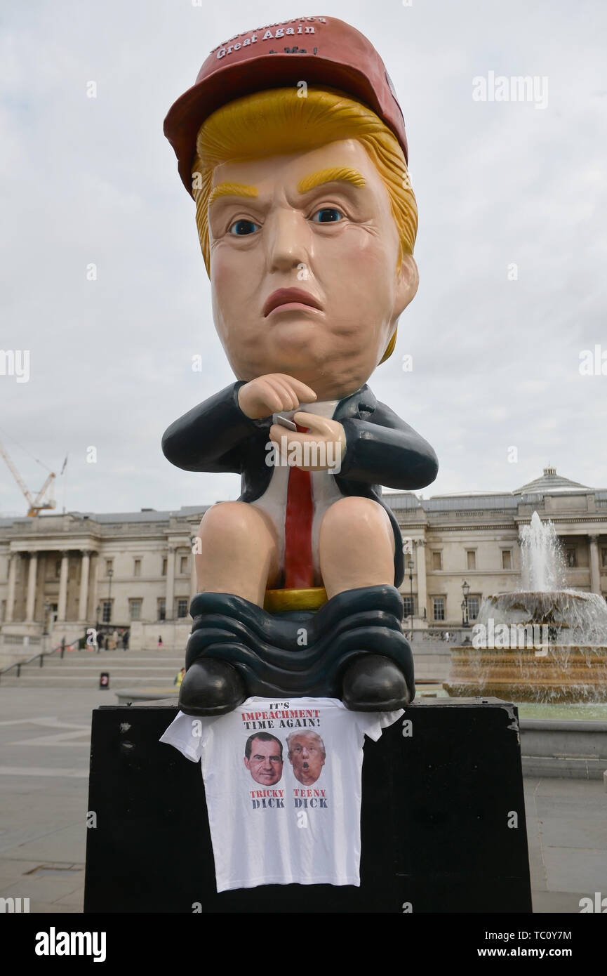 A 16ft talking robot of US President Donald Trump sitting on a gold toilet in Trafalgar Square, London on the second day of the state visit to the UK by US President Donald Trump. Stock Photo