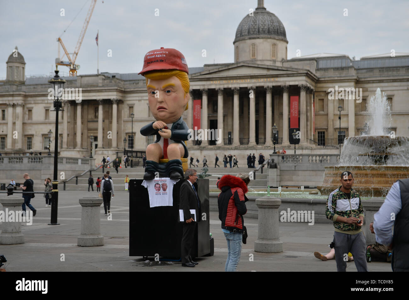 A 16ft talking robot of US President Donald Trump sitting on a gold toilet in Trafalgar Square, London on the second day of the state visit to the UK by US President Donald Trump. Stock Photo