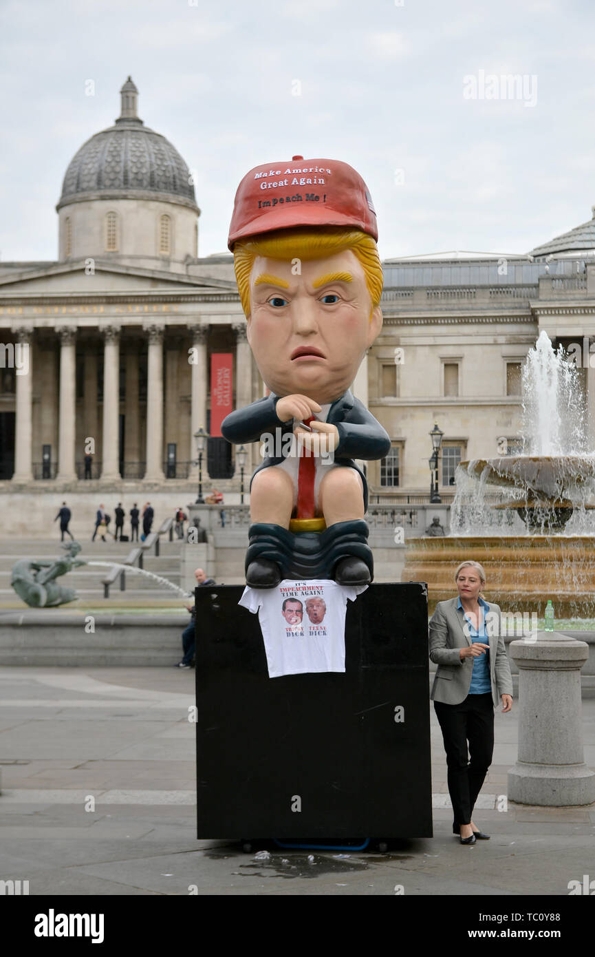 A 16ft talking robot of US President Donald Trump sitting on a gold toilet in Trafalgar Square, London on the second day of the state visit to the UK by US President Donald Trump. Stock Photo