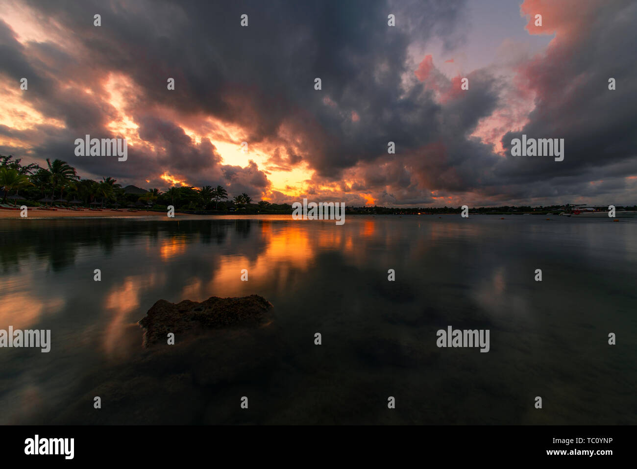 Sunset by the sea Stock Photo - Alamy