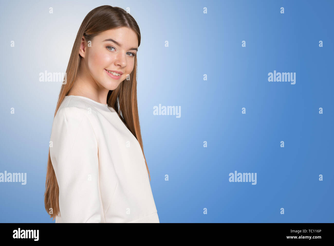 Portrait of confident young woman standing Stock Photo - Alamy