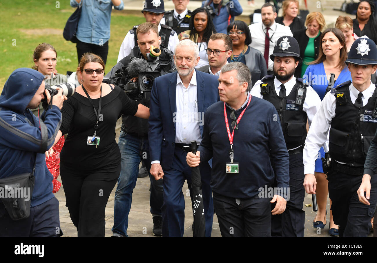 Labour party leader Jerermy Corbyn (centre) arrives to speak at an anti-Trump demonstration on Whitehall, London on the second day of the state visit to the UK by US President Donald Trump. Stock Photo