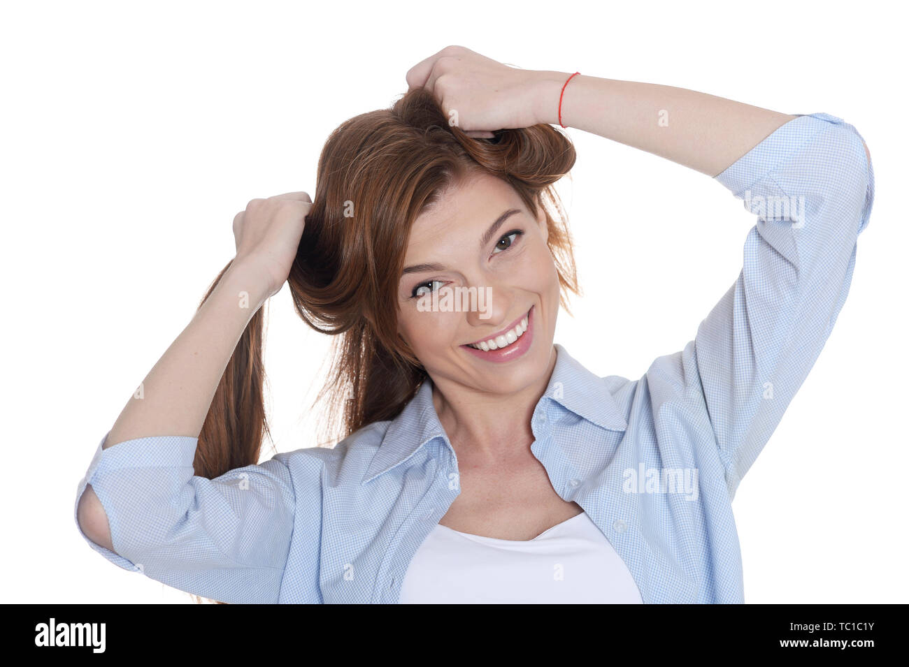 Portrait of beautiful smiling young woman posing isolated Stock Photo ...