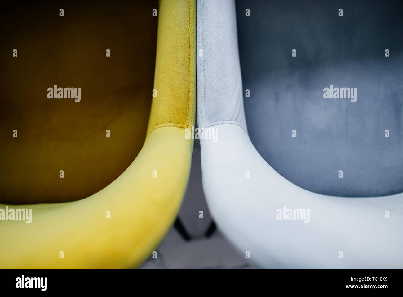 Modern cafe interior table chairs. Details of an interior of a small cafe. Two soft chairs top view. Stock Photo