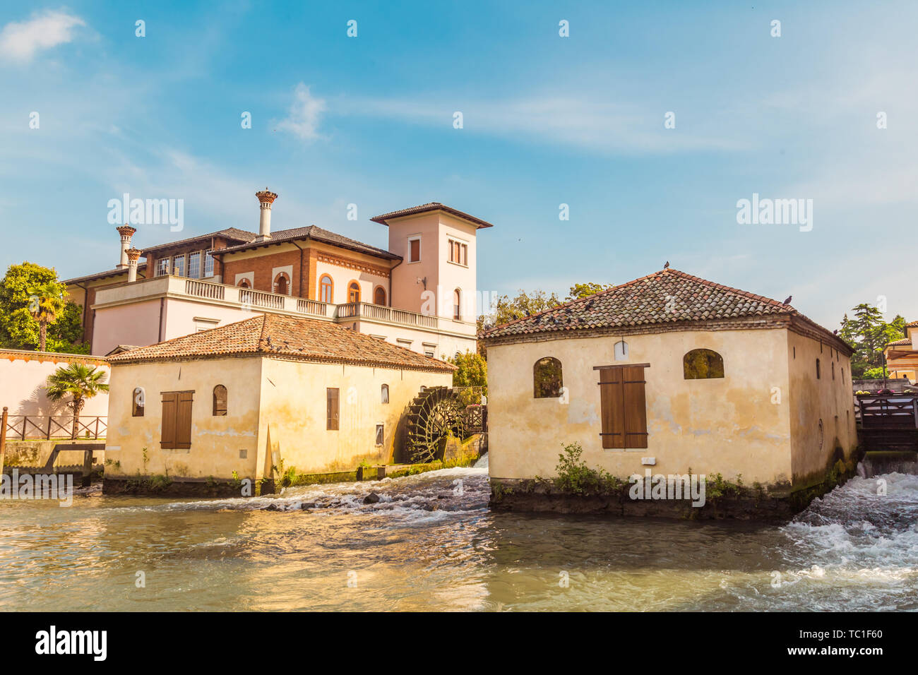 Cityscape of Portogruaro in Veneto Italy with lemene river, tower and mills Stock Photo