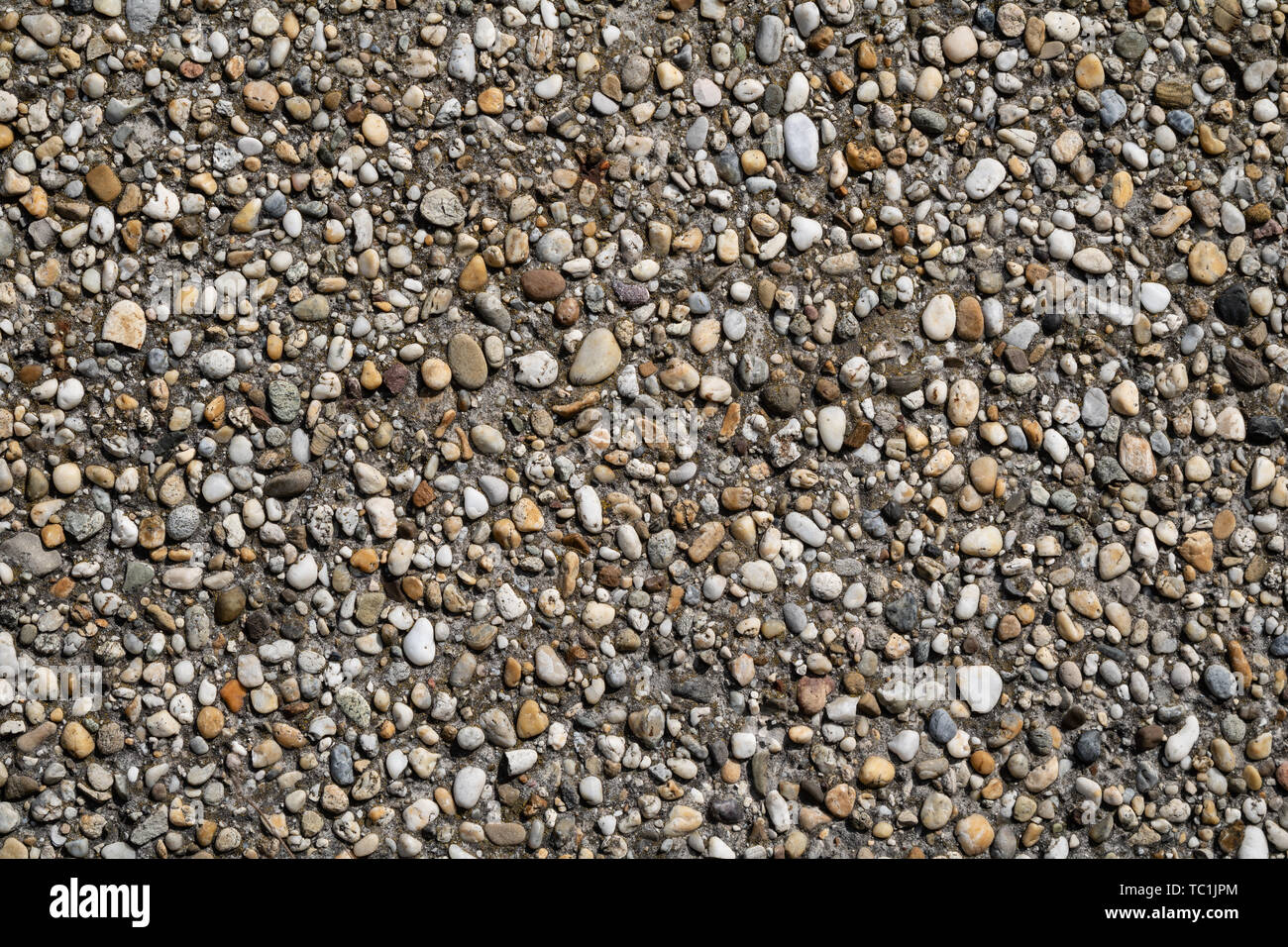 Aged pebble wall surface texture Stock Photo