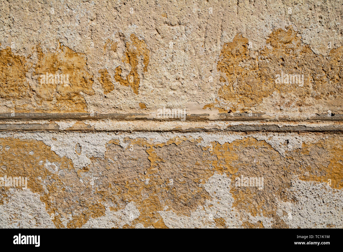 Yellow cracked weathered wall surface texture Stock Photo