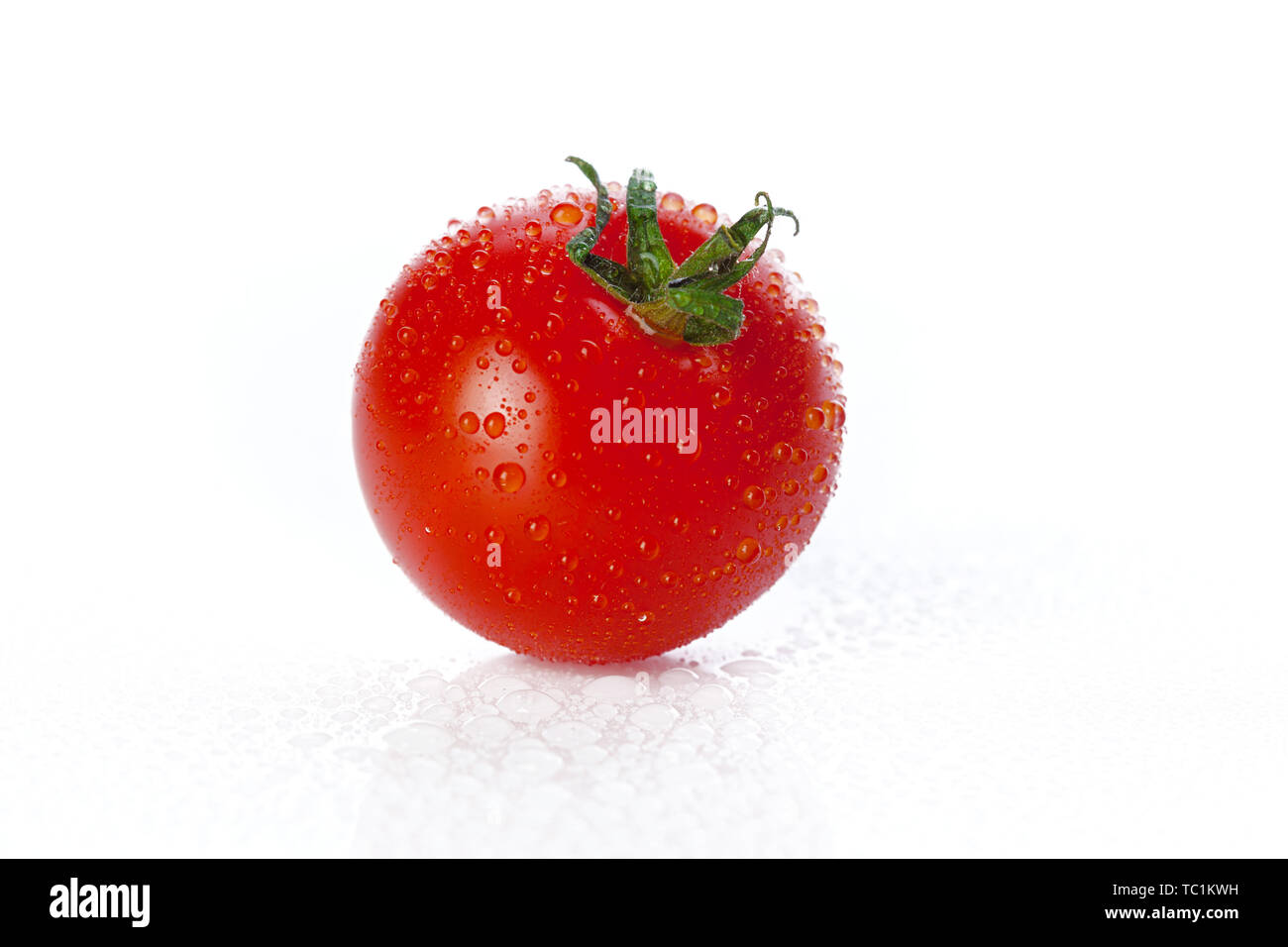 Fresh tomato isolated on white background Stock Photo - Alamy