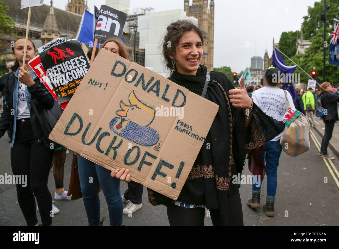 Protesters hold placards during the anti-Trump rally at the Parliament Square as the US President Donald Trump and First Lady Melania Trump meet the British Prime Minister Theresa May and her husband, Philip May in No10 Downing Street on the second day of the State Visit to the UK. Stock Photo