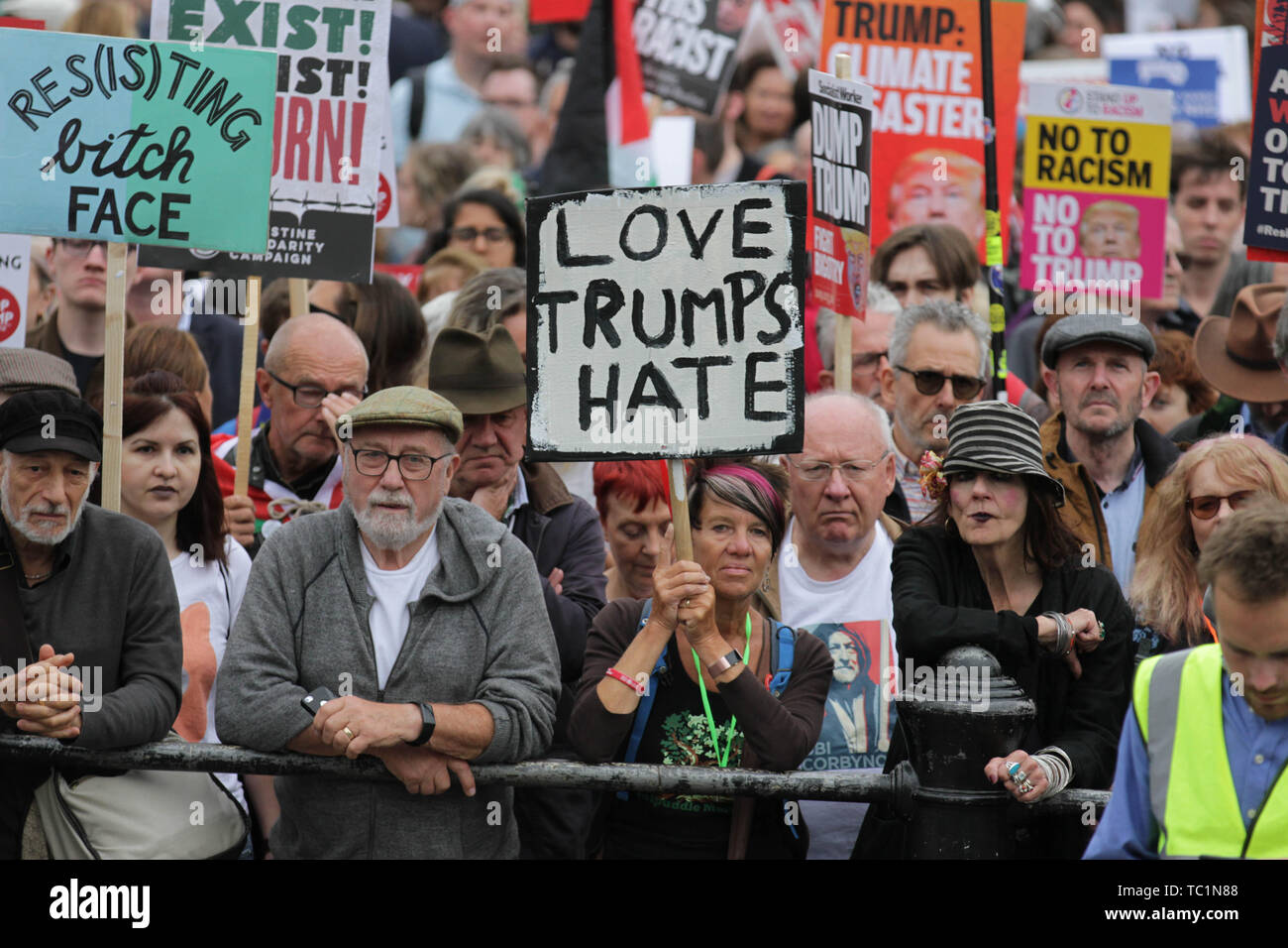 Demonstrators hold placards during the anti-Trump rally on the second day of the state visit of the American president to the UK. Stock Photo