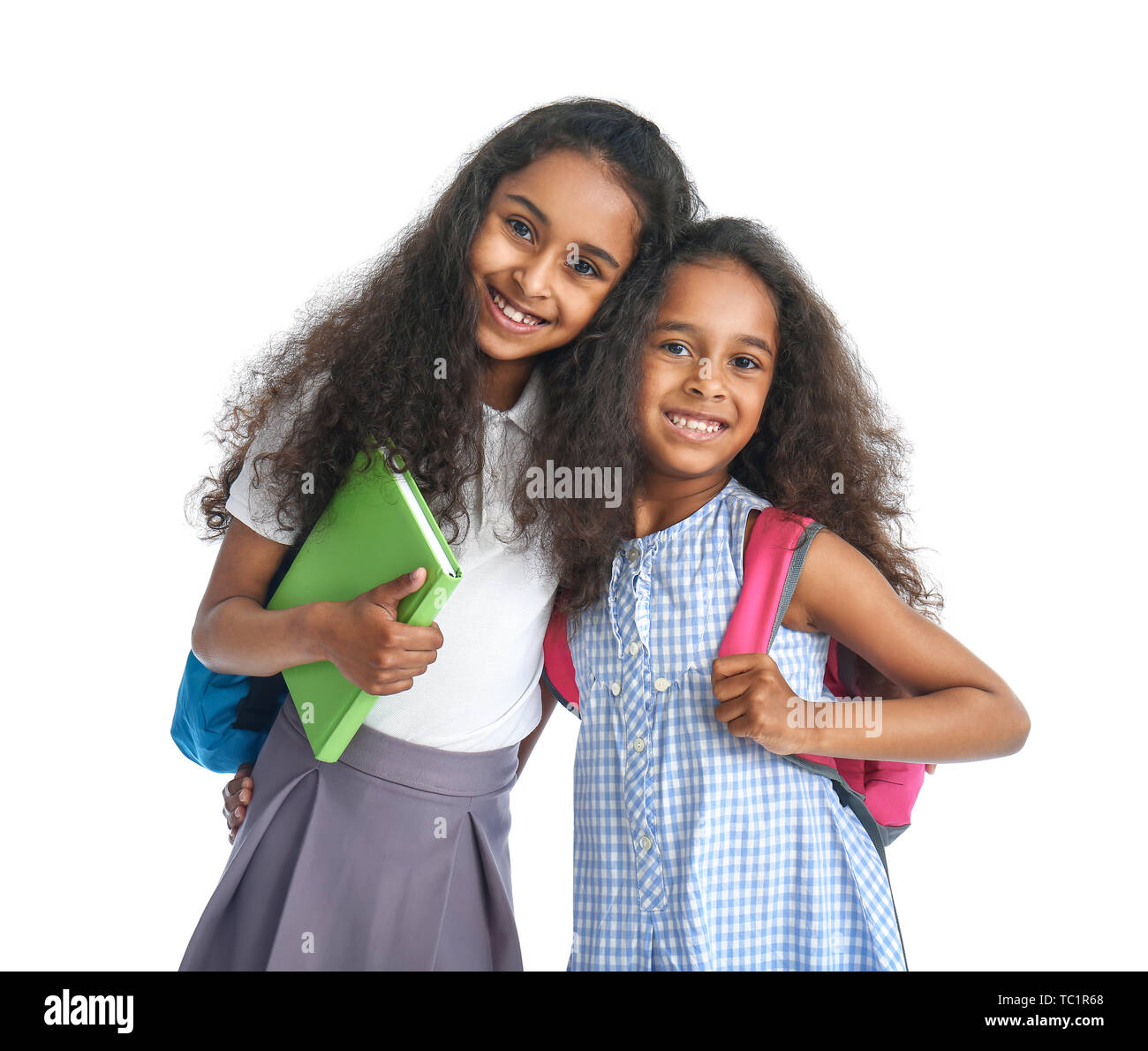 Cute African-American schoolgirls on white background Stock Photo