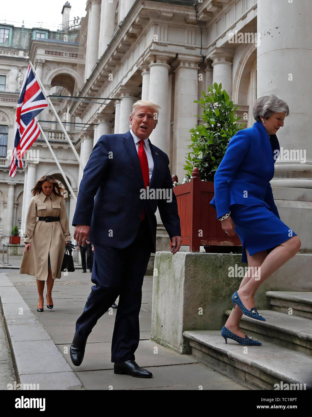 Prime Minister Theresa May and US President Donald Trump walk from Downing  Street to take part in their joint press conference at the Foreign &  Commonwealth Office, London, on the second day