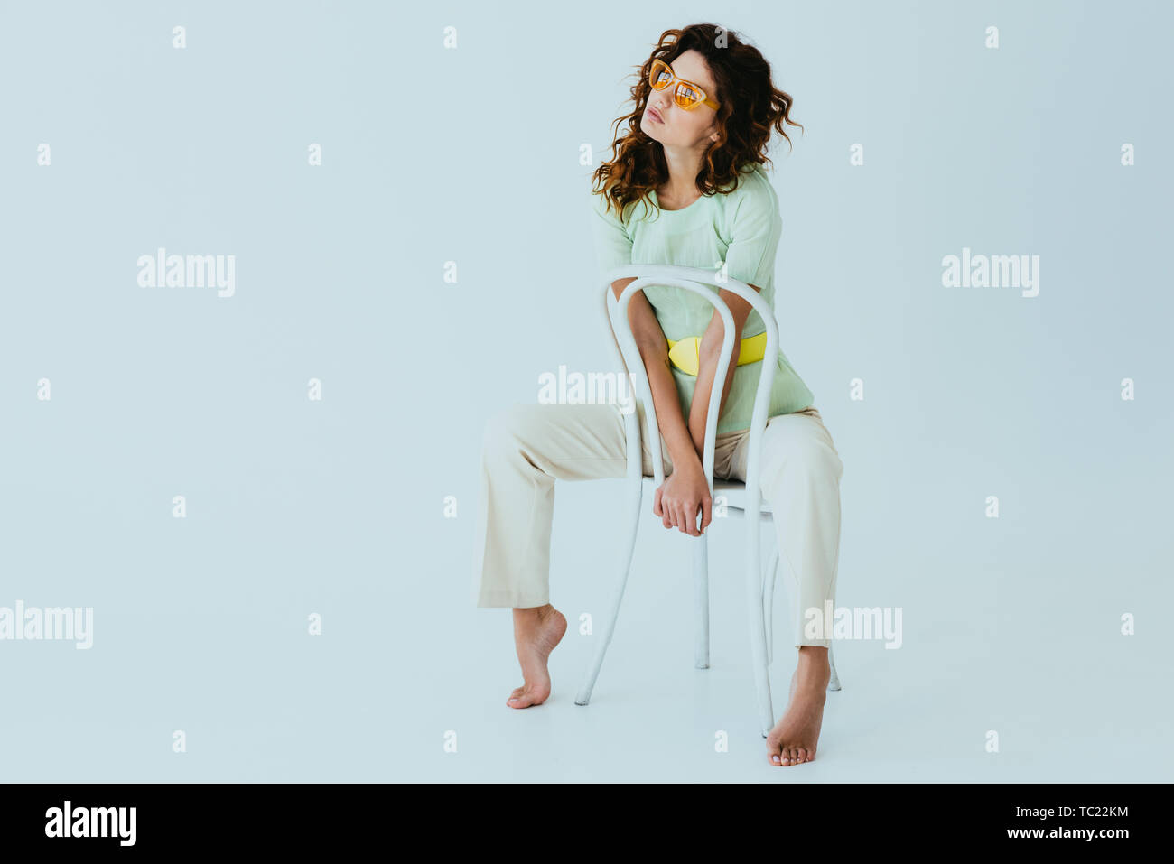 Sitting in chair barefoot hi-res stock photography and images - Alamy