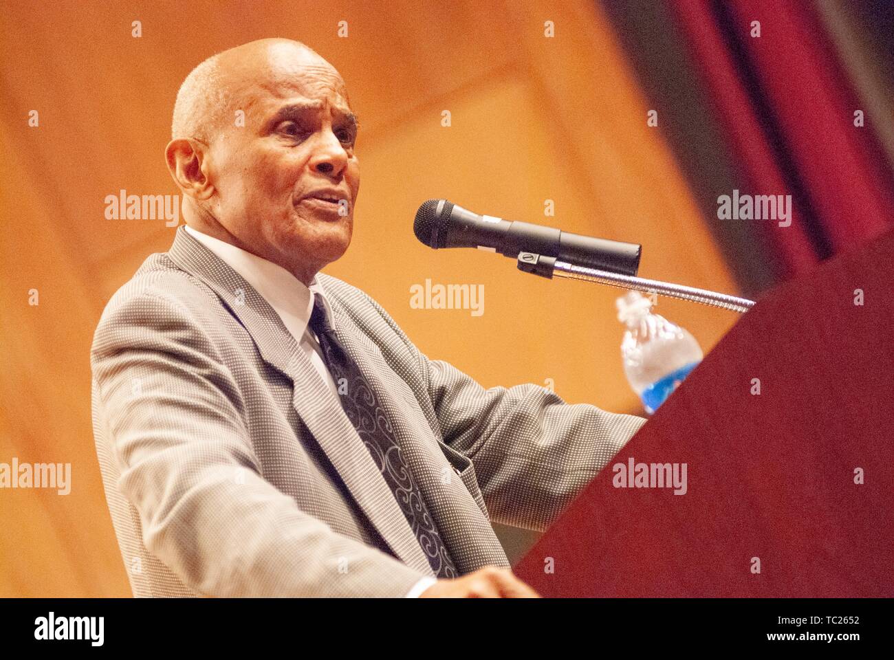 Low angle view of performer and activist Harry Belafonte, speaking from a podium during a Milton S Eisenhower Symposium, Homewood Campus of Johns Hopkins University, Baltimore, Maryland, September 19, 2006. From the Homewood Photography Collection. () Stock Photo