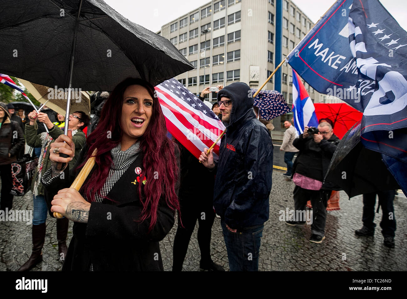 Jayda Fransen (left) former deputy leader of Britain First stages a corner protest with supporters at a 'Stop Trumpism' rally hosted by ExAct: Expat Action Group NI, at Belfast City Hall. Stock Photo