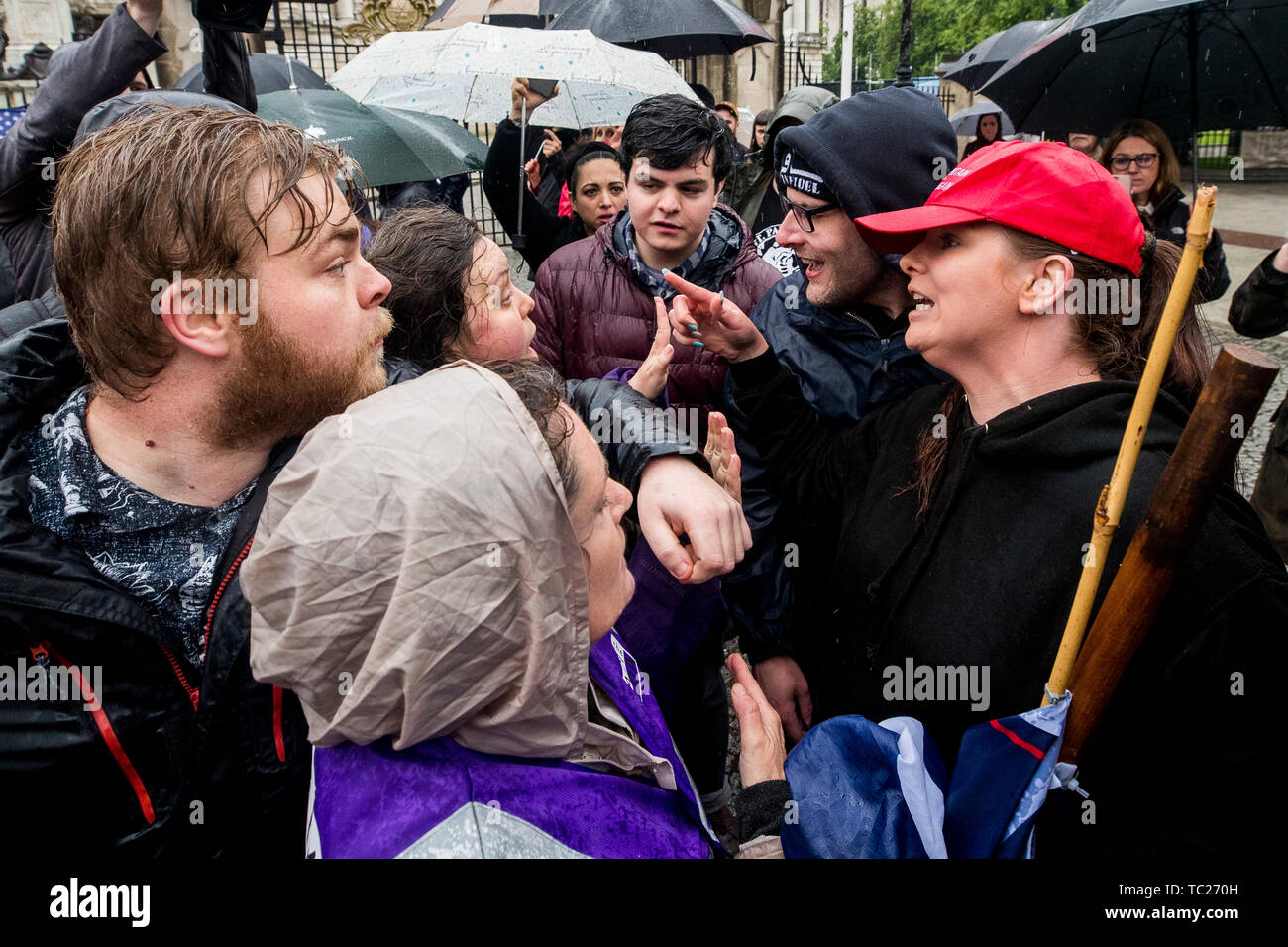 Former Belfast Councillor Jolene Bunting (right) with her partner Wayne Cummings (second from right) speaking with a stewards during a corner protest at a 'Stop Trumpism' rally hosted by ExAct: Expat Action Group NI, at Belfast City Hall. Stock Photo