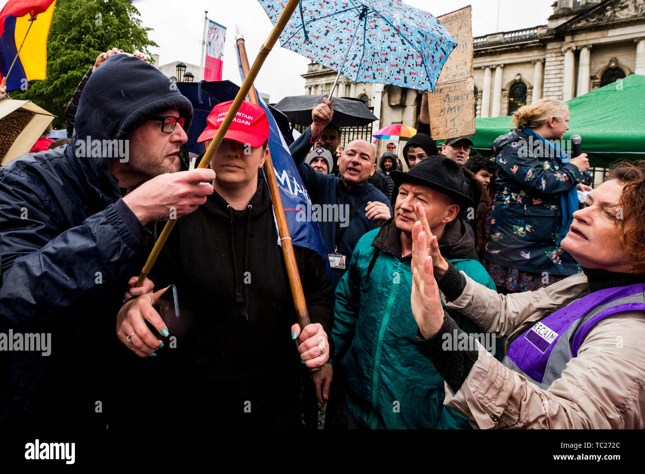 RETRANSMITTED CORRECTING SPELLING OF CUMMINGS Wayne Cummings (left) with his partner former Belfast Councillor Jolene Bunting (second from left) speaking with a steward during a corner protest at a 'Stop Trumpism' rally hosted by ExAct: Expat Action Group NI, at Belfast City Hall. Stock Photo