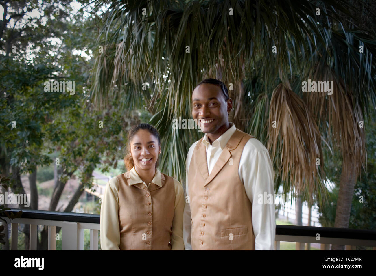 Portrait of young adult male and female wait staff. Stock Photo