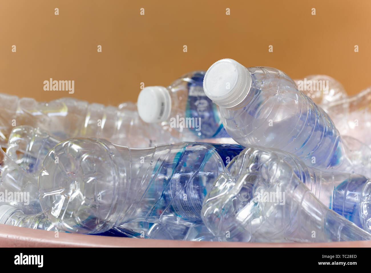 Recyclable garbage of glass plastic bottles in rubbish bin Stock Photo