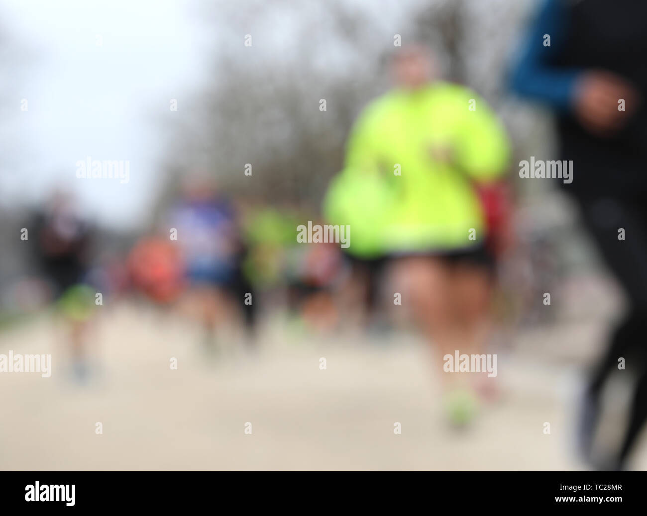 foot race with unrecognizable runners and INTENTIONALLY BLURRED to use ...