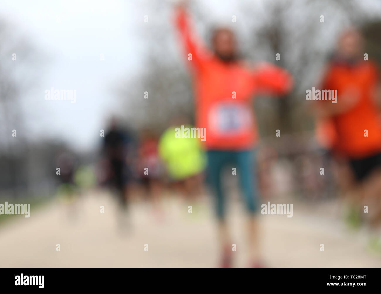 foot race with many unrecognizable runners and INTENTIONALLY BLURRED to ...