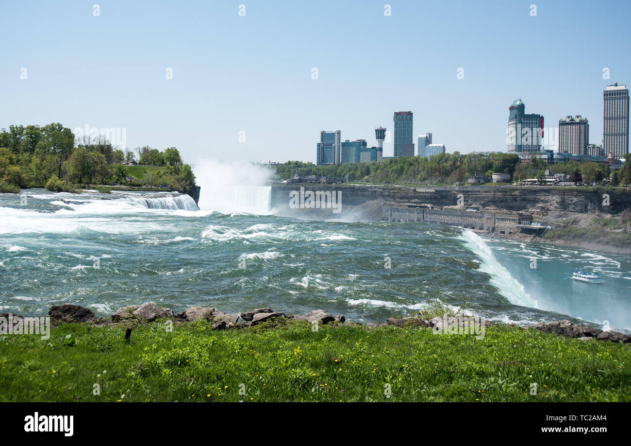 Niagara falls with Canada border buildings in background Stock Photo Alamy