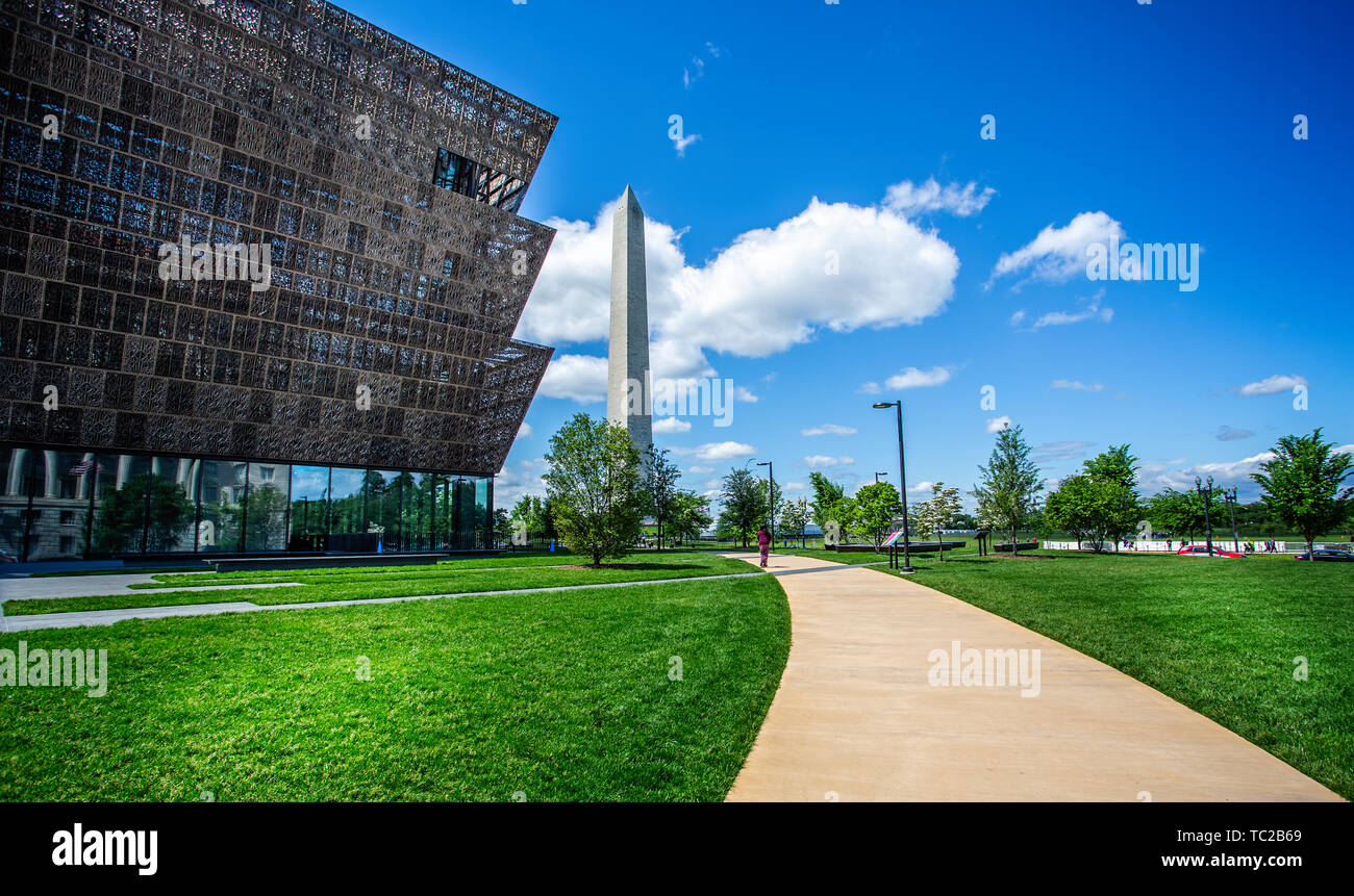 National Museum of African American History and Culture and The Washington Monument in Washington DC, USA on 14 May 2019 Stock Photo