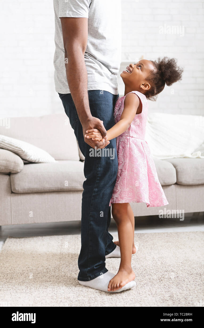 Little african american girl dancing with father Stock Photo