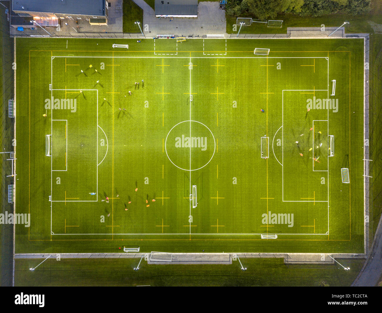 Aerial view of soccer field while athletes are training at night under