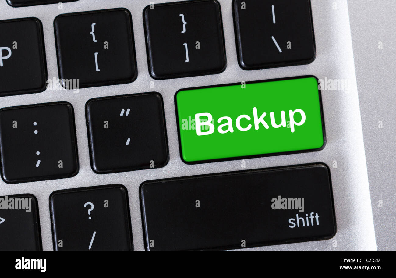 Backup green button on computer keyboard, closeup Stock Photo Alamy