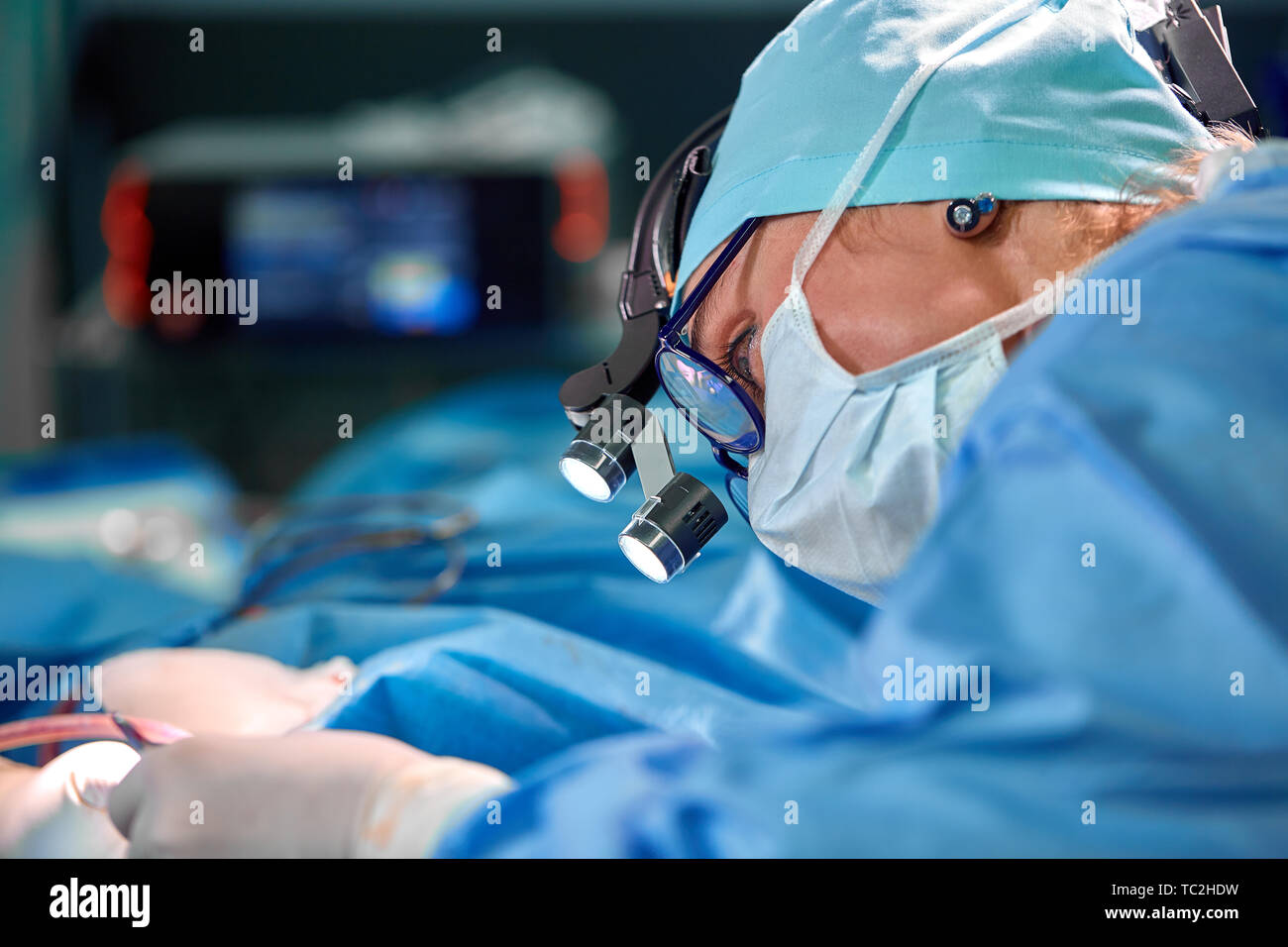 Close up portrait of female surgeon doctor wearing protective mask and ...