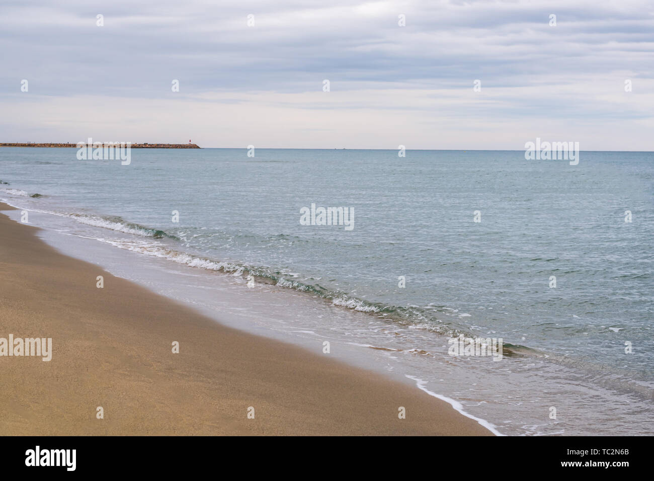 Desert beach view under a cloudy sky on a summer day Stock Photo - Alamy