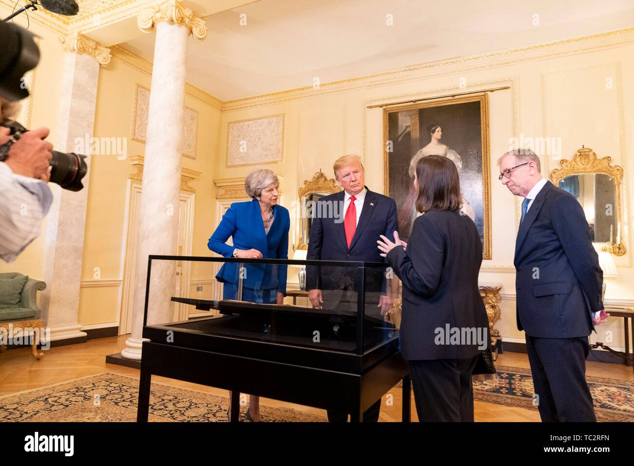 London, UK. 04th June, 2019. U.S President Donald Trump outgoing British Prime Minister Theresa May and her husband Philip May, right, view an original copy of the U.S. Declaration of Independence during a tour of historic documents at #10 Downing Street June 4, 2019 in London, England. The handwritten parchment copy of the U.S. Declaration of Independence, known as the Sussex Declaration, is one of only two known to exist. Credit: Planetpix/Alamy Live News Stock Photo