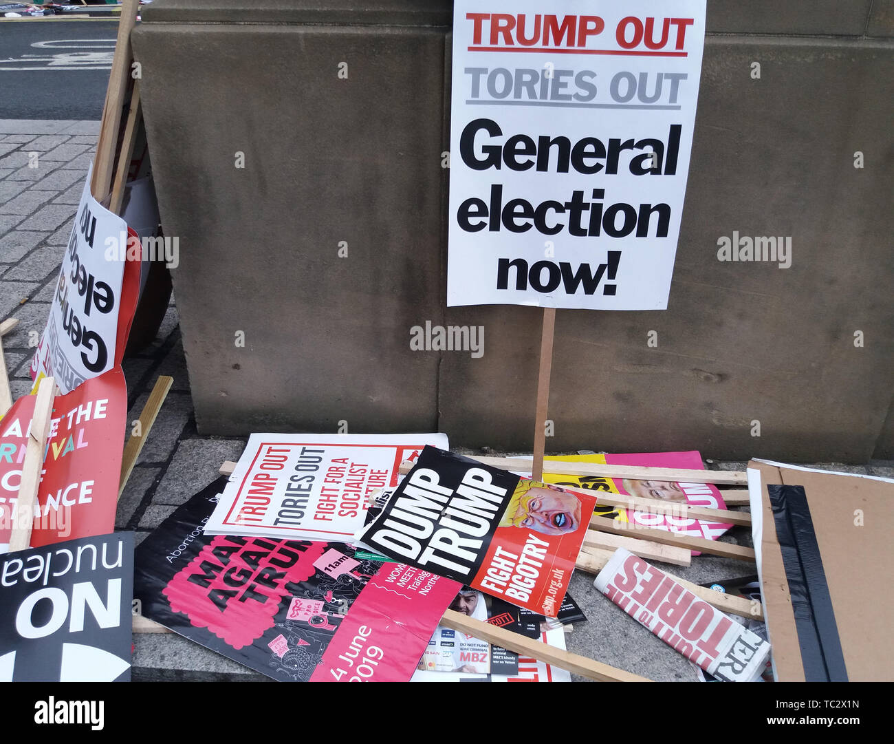 London, UK. 04th June, 2019. Scores of discarded and dumped placards protesting against US President Donald Trump's state visit to the UK. The President's stance on climate change, racism and pollution has seen protesters angry, yet these placards were just strewn around the surrounding streets, showing total disregard and double standards for the things they supposedly stand for. Credit: SOPA Images Limited/Alamy Live News Stock Photo