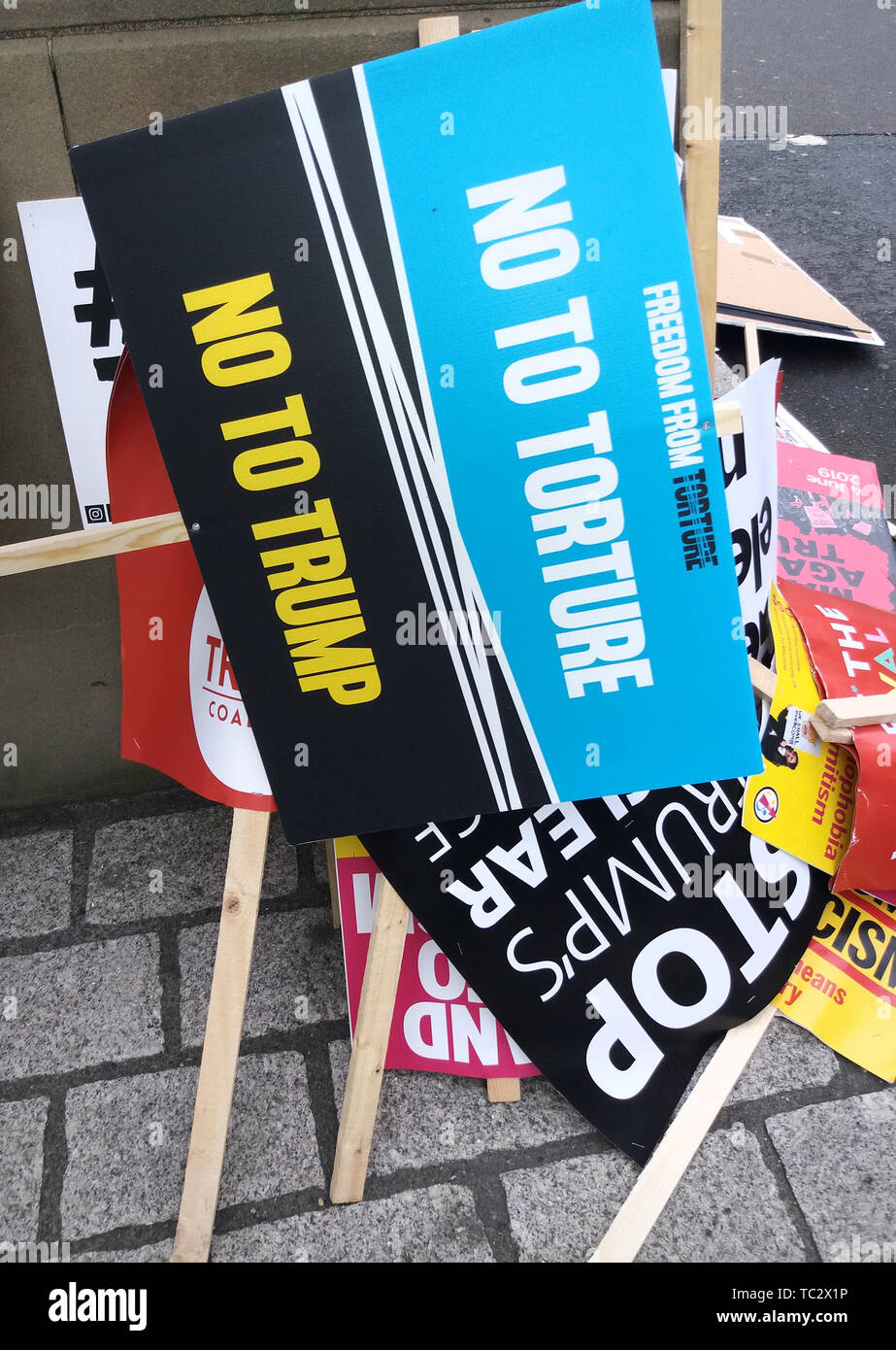 London, UK. 04th June, 2019. Scores of discarded and dumped placards protesting against US President Donald Trump's state visit to the UK. The President's stance on climate change, racism and pollution has seen protesters angry, yet these placards were just strewn around the surrounding streets, showing total disregard and double standards for the things they supposedly stand for. Credit: SOPA Images Limited/Alamy Live News Stock Photo