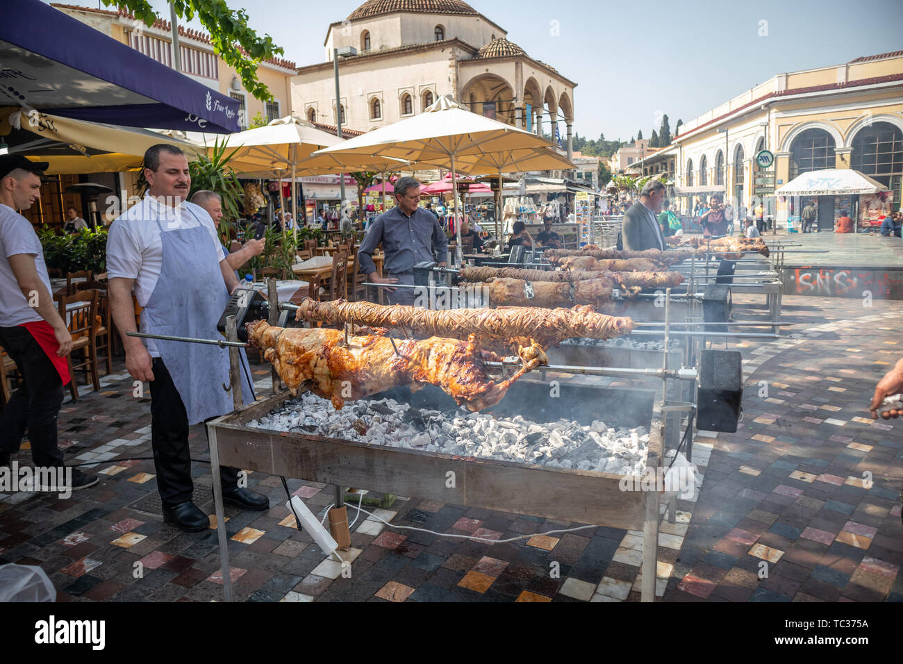 April 28, 2019. Athens, Greece. Kokorec and lamb are grilling on skewers over charcoal fire. Greek Easter custom, Monastiraki Stock Photo